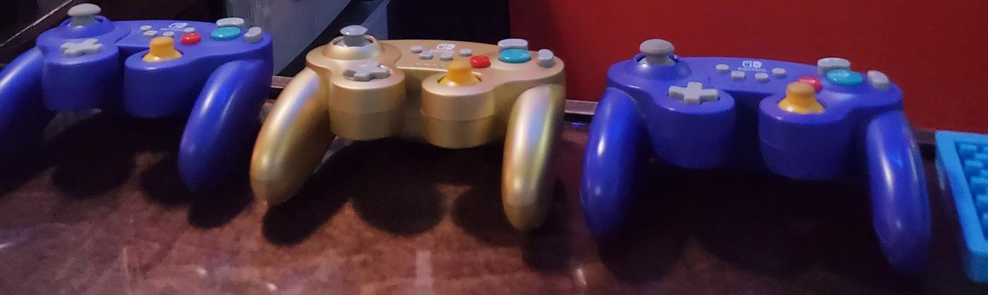 Three game controllers sitting on the bar top at Club Geek.